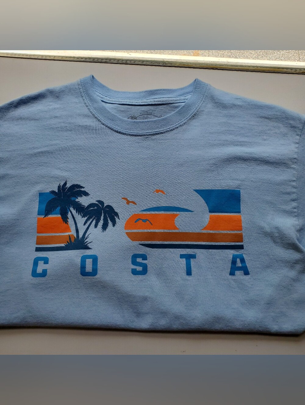 Costa Light Blue Tee with Orange and Navy Coastal Graphic Mens Size Medium